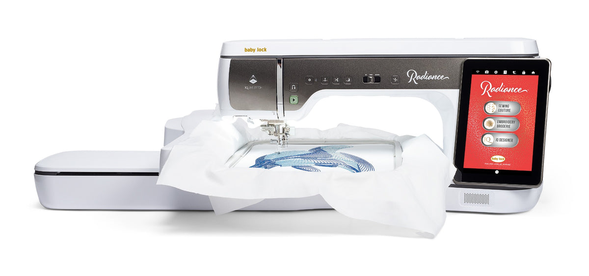 Baby Lock Radiance sewing and embroidery machine with an expansive 11 5/8" x 18 1/4" embroidery hoop showing a large, intricate design being stitched onto fabric.