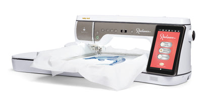 A Baby Lock Radiance Sewing Embroidery Machine with a white piece of fabric loaded, showcasing the embroidery hoop and the machine's control panel with a touchscreen.